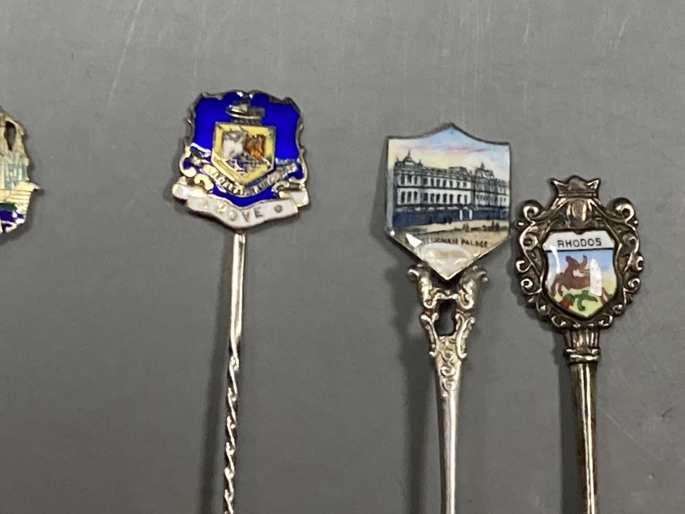 Six 20th century assorted silver and enamel souvenir spoons, gross 81 grams and five similar white metal and enamel spoons,
